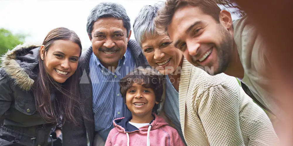 UK Charity Worker Visa 22 Smiling multigenerational family posing together outdoors