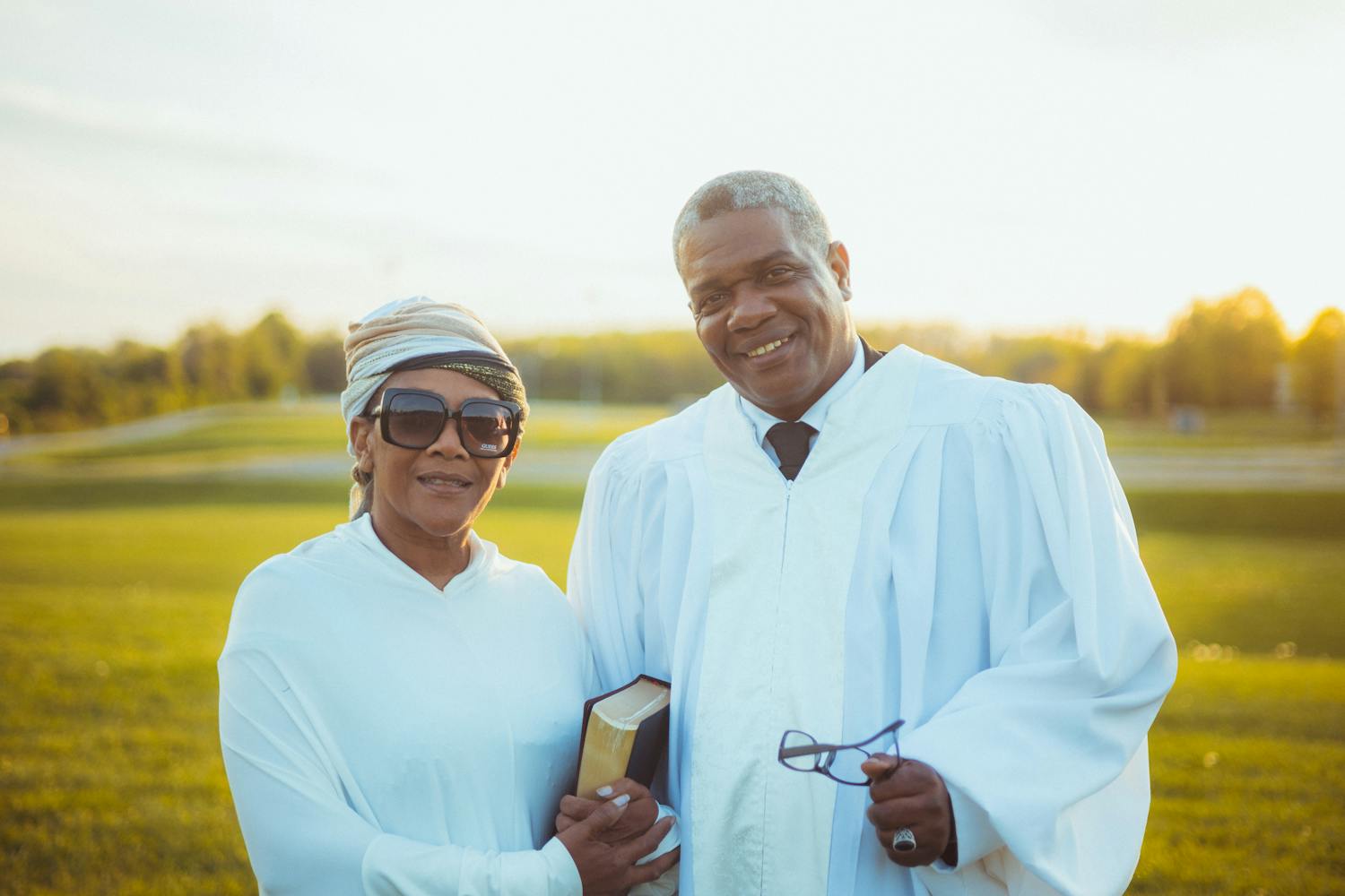 Two faith leaders wearing religious garments during an outdoor service