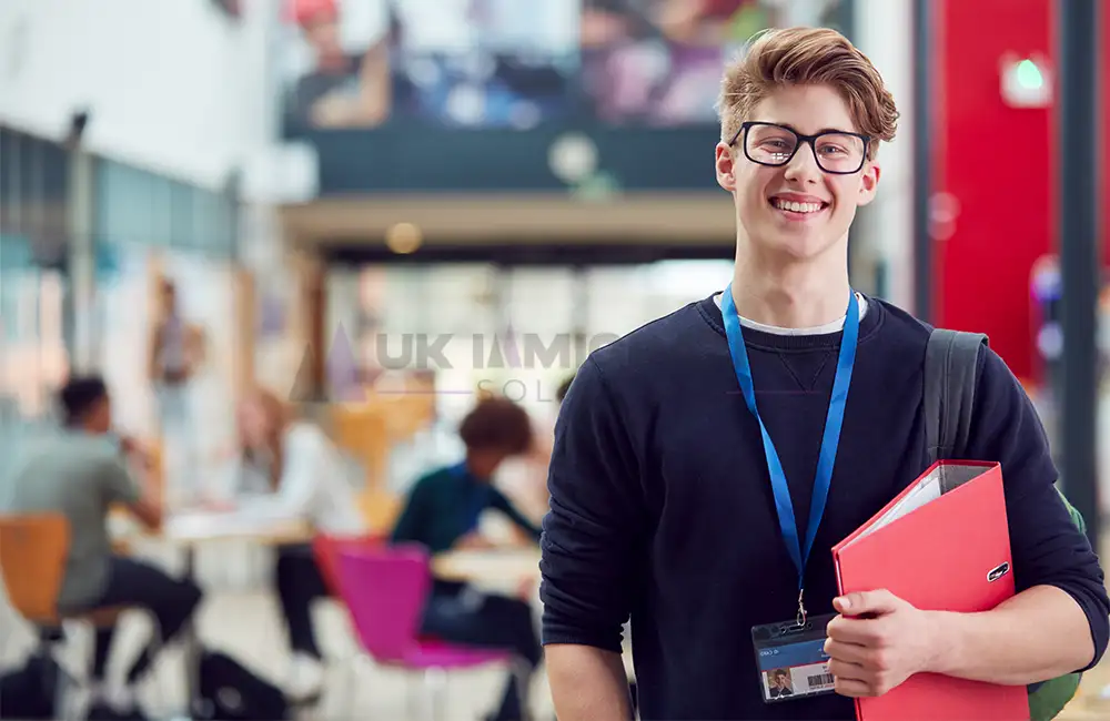 UK High Potential Individual Visa 21 International graduate holding study materials at a UK university campus