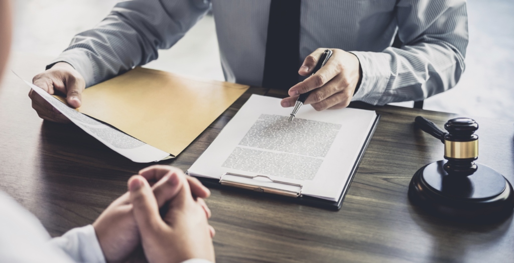 Employer reviewing refusal documents with an adviser after a UK sponsor licence application is rejected